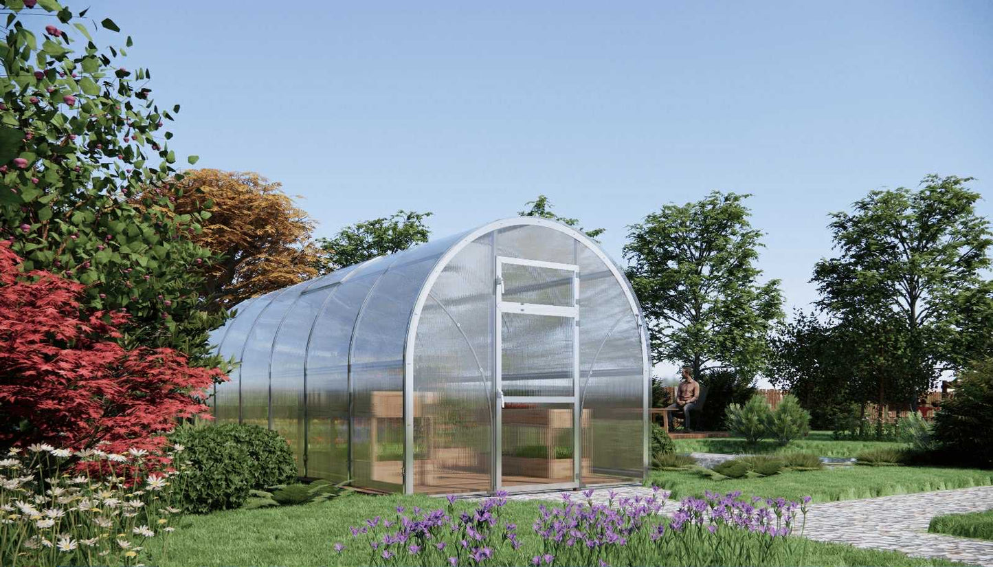 Sigma 250 (Gen III) greenhouse in a garden setting with trees and flowers